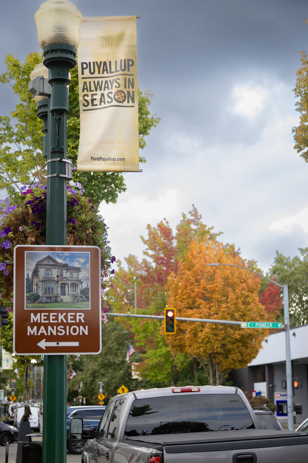 Puyallup street banner and Meeker Mansion wayfinding sign